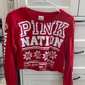 Long sleeve, red and white crop top. It is a XS in womens.